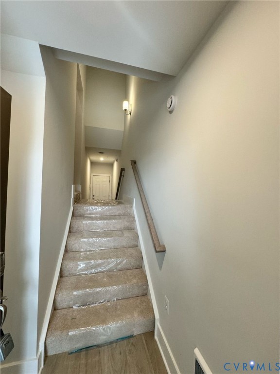 1512 West Moore Street, Unit B Richmond, VA 23220 - Photo 29 of 34 Stairs featuring baseboards and wood finished floo