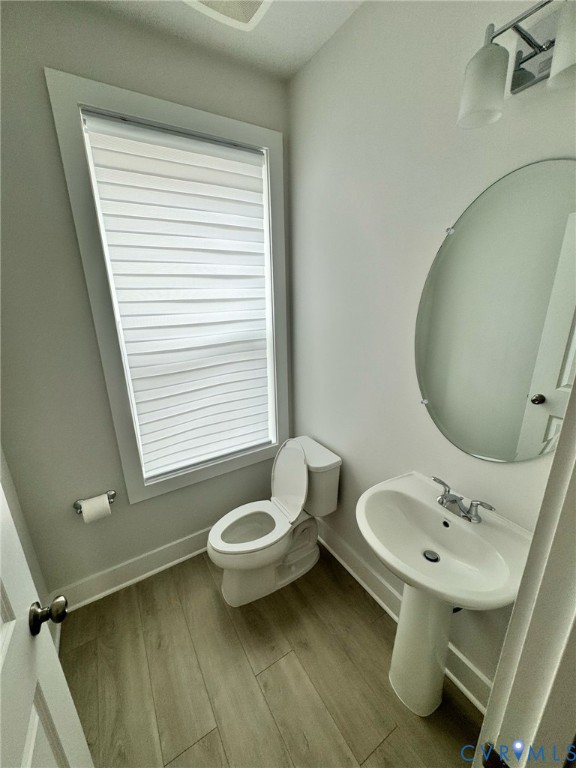 1512 West Moore Street, Unit B Richmond, VA 23220 - Photo 8 of 34 Bathroom with baseboards and wood finished floors