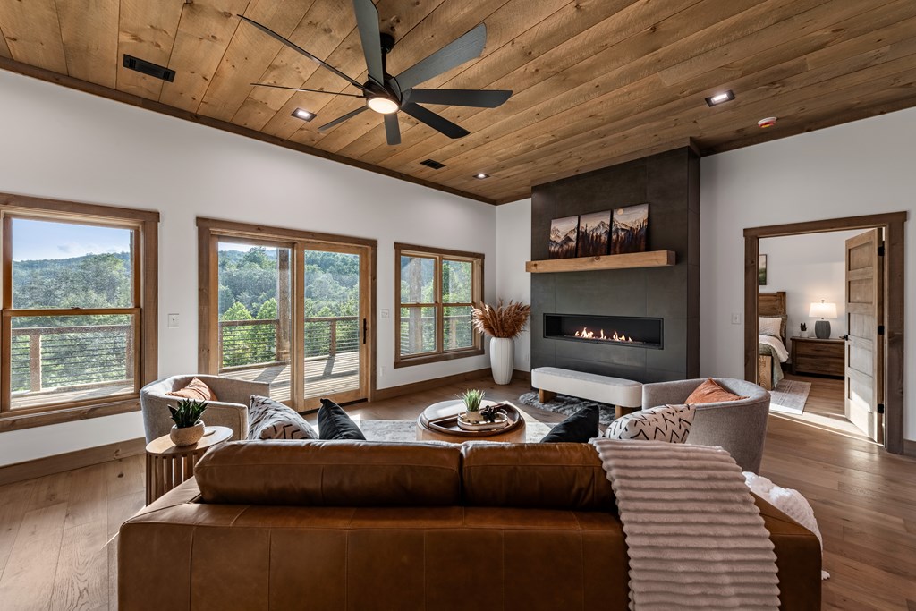 17 Rich Mountain Cherry Log, GA 30522 - Photo 20 of 57 a living room with furniture a fireplace and a flat screen tv