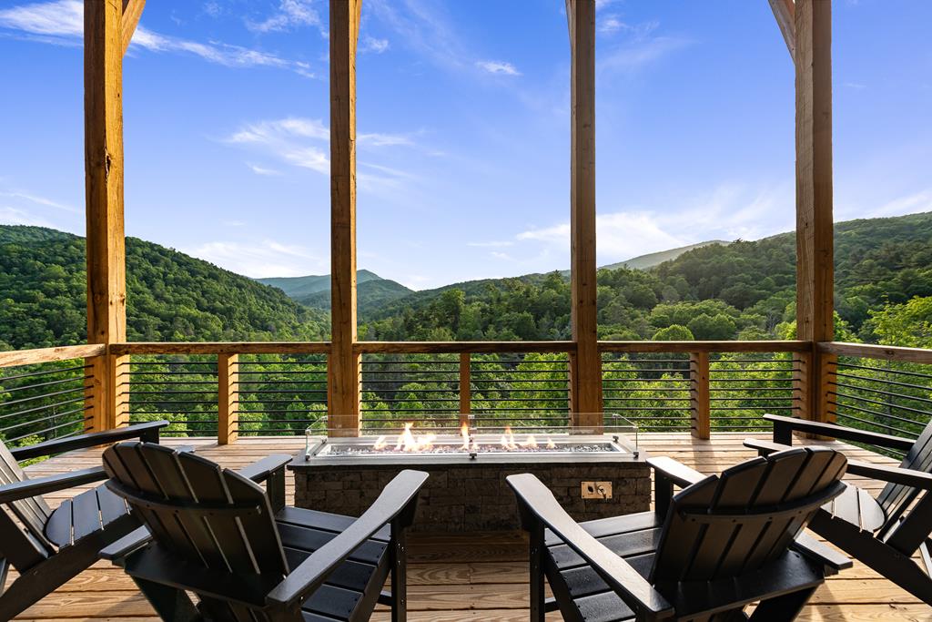 17 Rich Mountain Cherry Log, GA 30522 - Photo 2 of 57 a balcony with wooden floor table and chairs