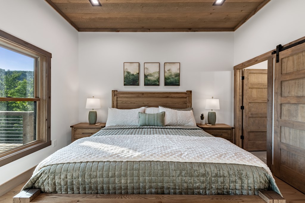 17 Rich Mountain Cherry Log, GA 30522 - Photo 23 of 57 a bedroom with a large bed and a window