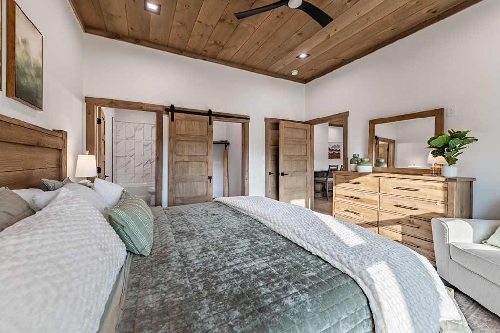 17 Rich Mountain Cherry Log, GA 30522 - Photo 24 of 57 a spacious bedroom with a bed a flat screen tv and balcony