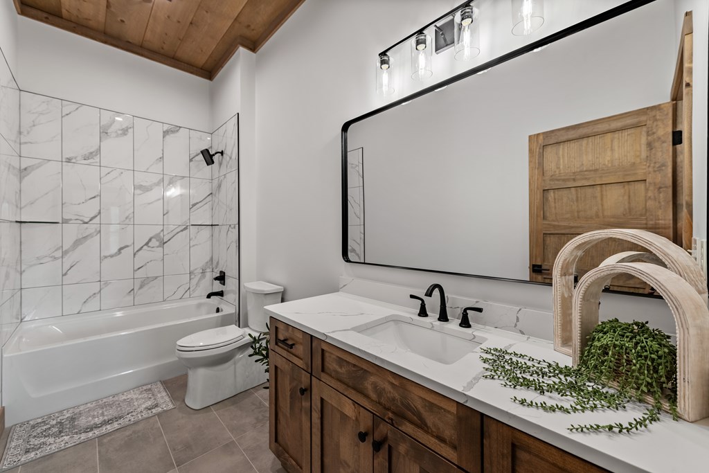 17 Rich Mountain Cherry Log, GA 30522 - Photo 25 of 57 a bathroom with a granite countertop sink a toilet and shower