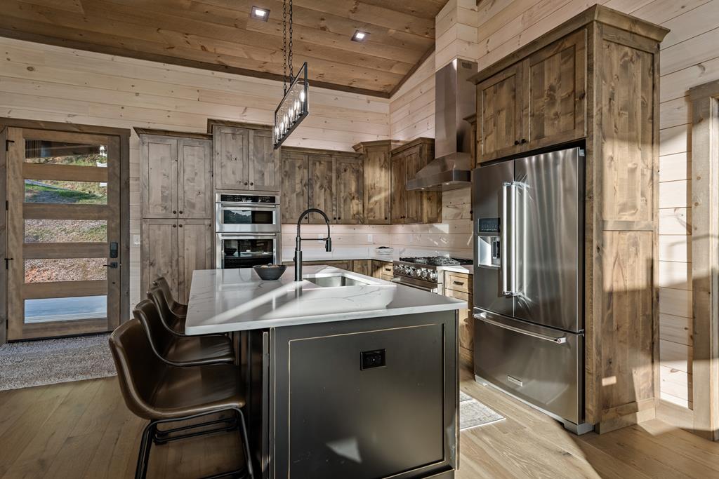 17 Rich Mountain Cherry Log, GA 30522 - Photo 33 of 57 a kitchen with stainless steel appliances granite countertop a sink refrigerator and cabinets