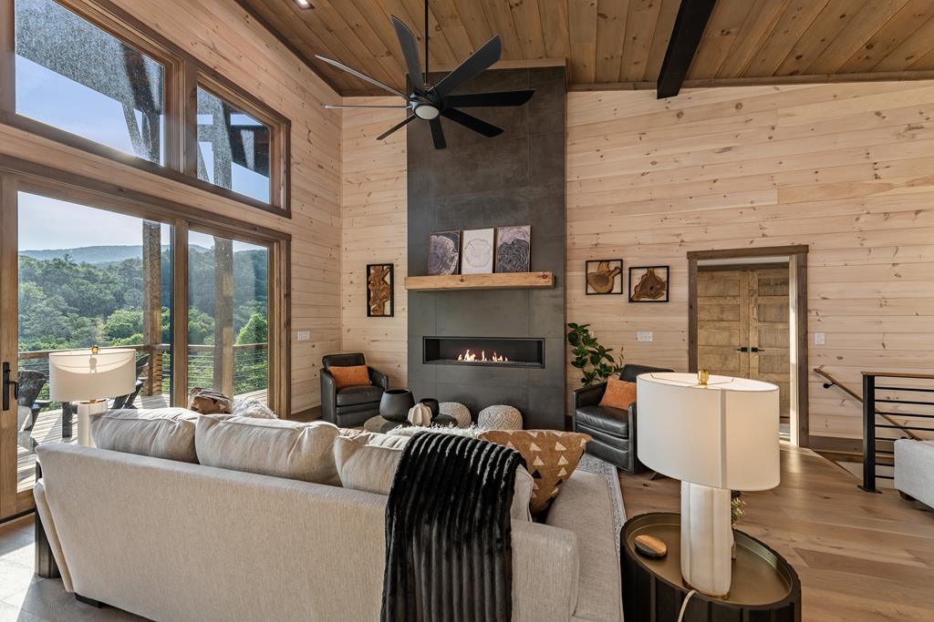 17 Rich Mountain Cherry Log, GA 30522 - Photo 36 of 57 a living room with furniture and a fireplace