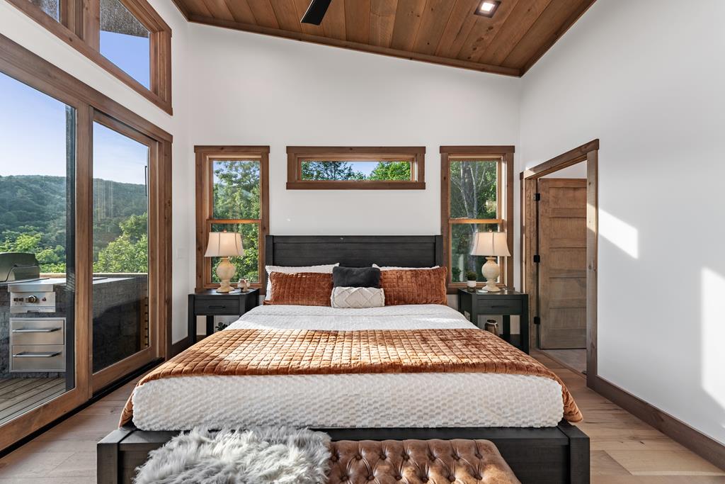 17 Rich Mountain Cherry Log, GA 30522 - Photo 42 of 57 a bedroom with a large bed and a large window