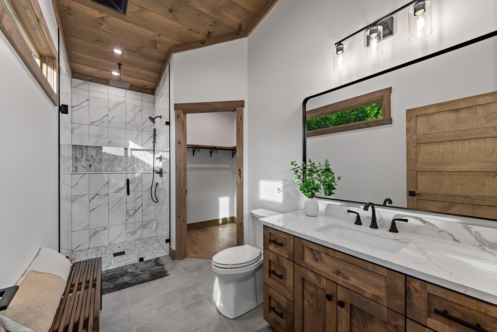 17 Rich Mountain Cherry Log, GA 30522 - Photo 44 of 57 a bathroom with a sink a toilet and shower