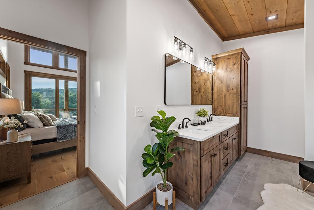 17 Rich Mountain Cherry Log, GA 30522 - Photo 45 of 57 a bathroom with a sink and a mirror