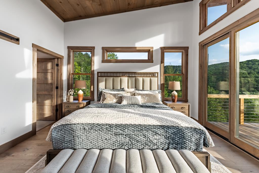 17 Rich Mountain Cherry Log, GA 30522 - Photo 48 of 57 a bedroom with a large bed and a large window