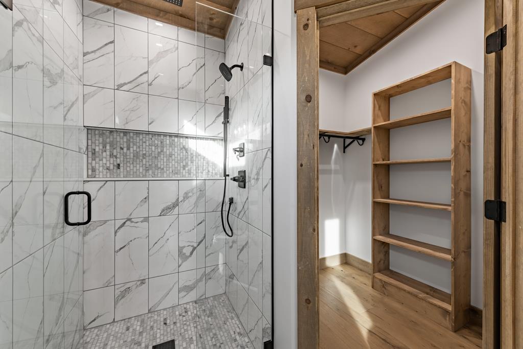 17 Rich Mountain Cherry Log, GA 30522 - Photo 49 of 57 a bathroom with a glass shower door