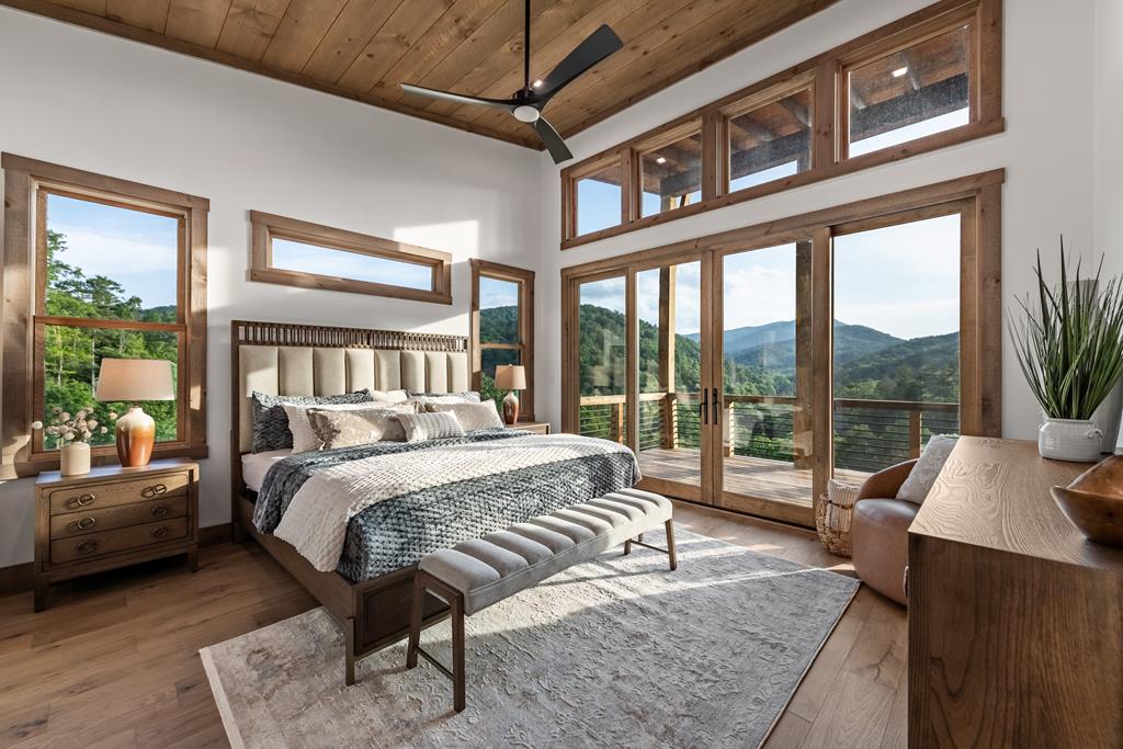 17 Rich Mountain Cherry Log, GA 30522 - Photo 10 of 57 a bedroom with a bed couch and a large window