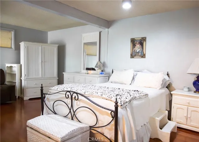 a living room with furniture a couch a dining table and kitchen view