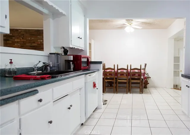 a kitchen with stainless steel appliances a sink and a counter top space