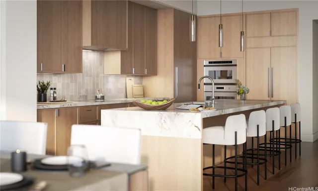a kitchen with kitchen island granite countertop a table chairs sink and cabinets