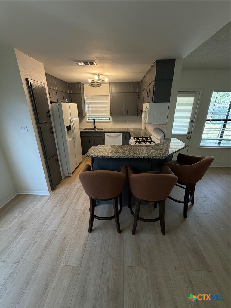 1316 Opal Road, Unit A Killeen, TX 76543 - Photo 10 of 25 a view of a dining room with furniture and wooden floor