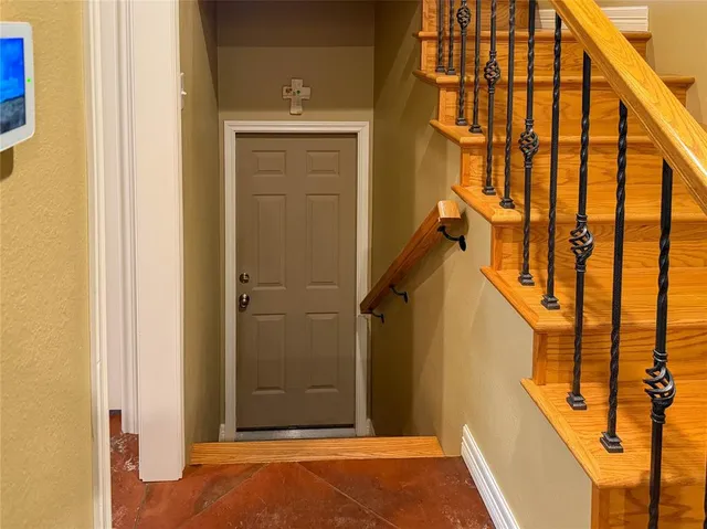 a view of balcony with wooden floor and door