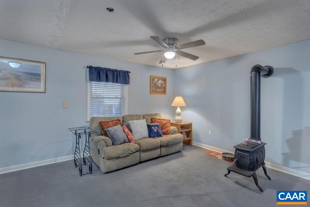 3 Stonefield Road Palmyra, VA 22963 - Photo 19 of 48 a living room with furniture and a large window