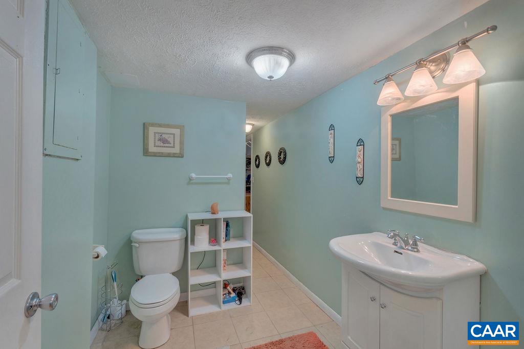 3 Stonefield Road Palmyra, VA 22963 - Photo 26 of 48 a bathroom with a sink mirror vanity and toilet