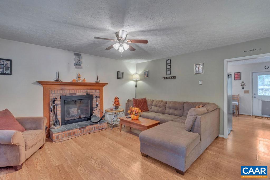 3 Stonefield Road Palmyra, VA 22963 - Photo 6 of 48 a living room with furniture and a fireplace