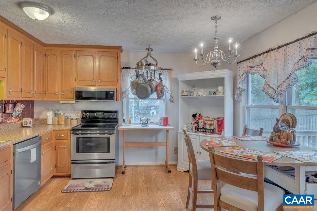 3 Stonefield Road Palmyra, VA 22963 - Photo 7 of 48 a kitchen that has a lot of cabinets furniture and appliances