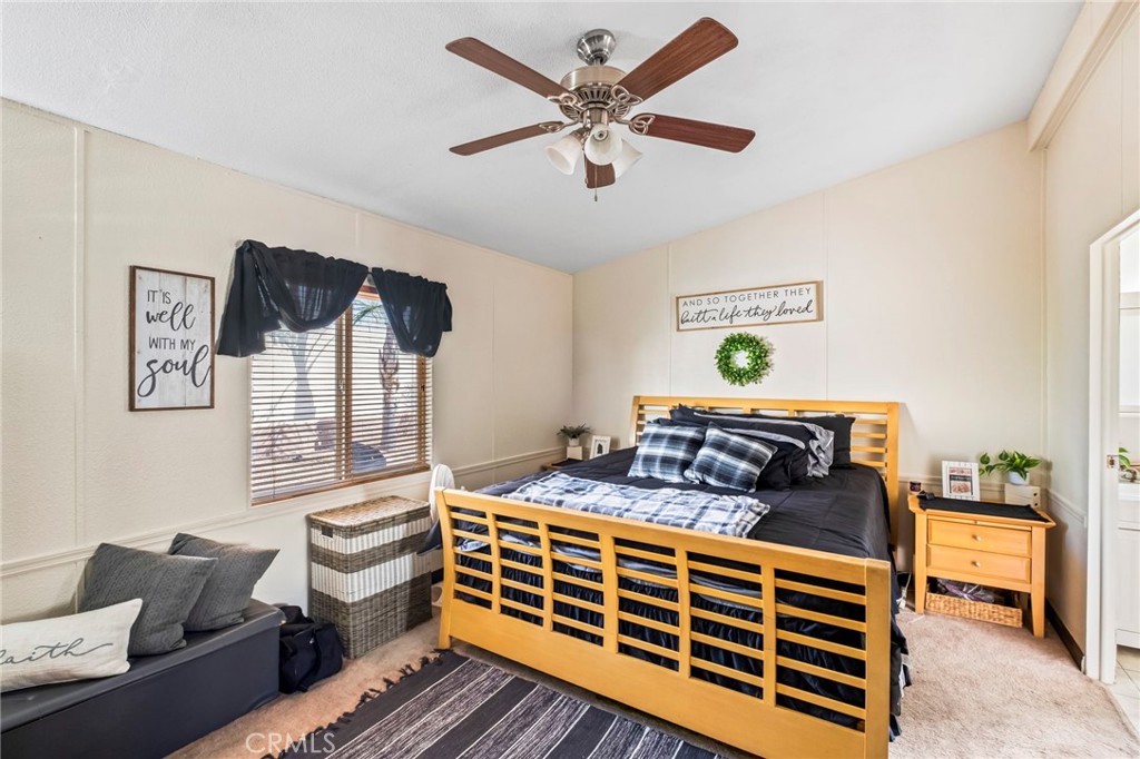 24847 Split Rail Road Wildomar, CA 92595 - Photo 11 of 45 a bedroom with furniture and a bed