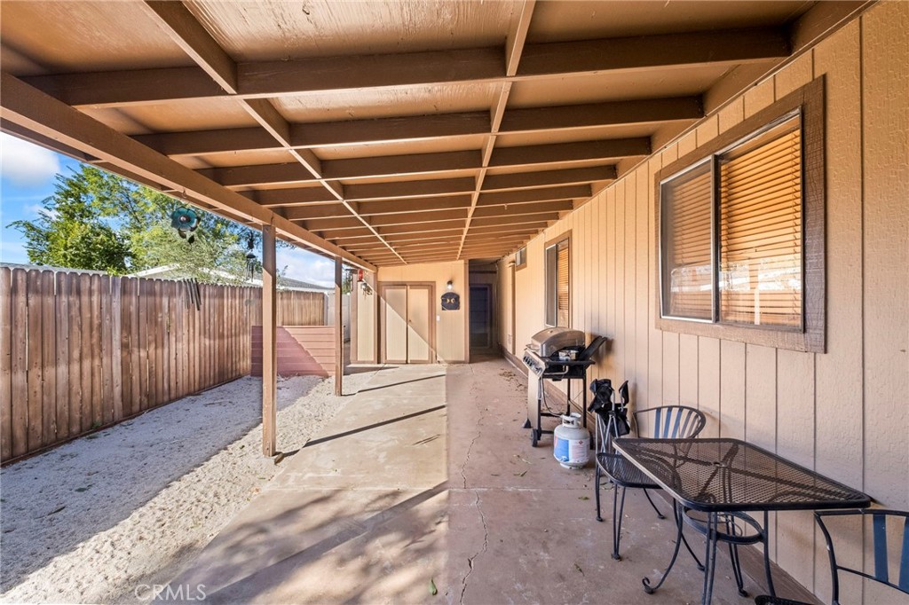 24847 Split Rail Road Wildomar, CA 92595 - Photo 21 of 45 a view of a chairs and table in a patio