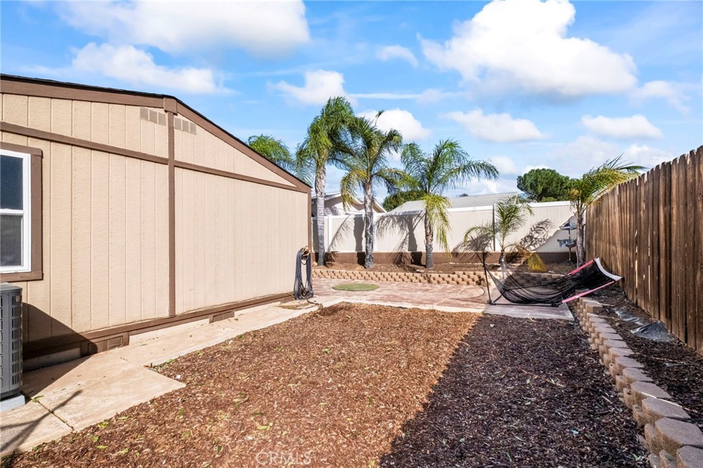 24847 Split Rail Road Wildomar, CA 92595 - Photo 24 of 45 a view of a backyard with potted plants