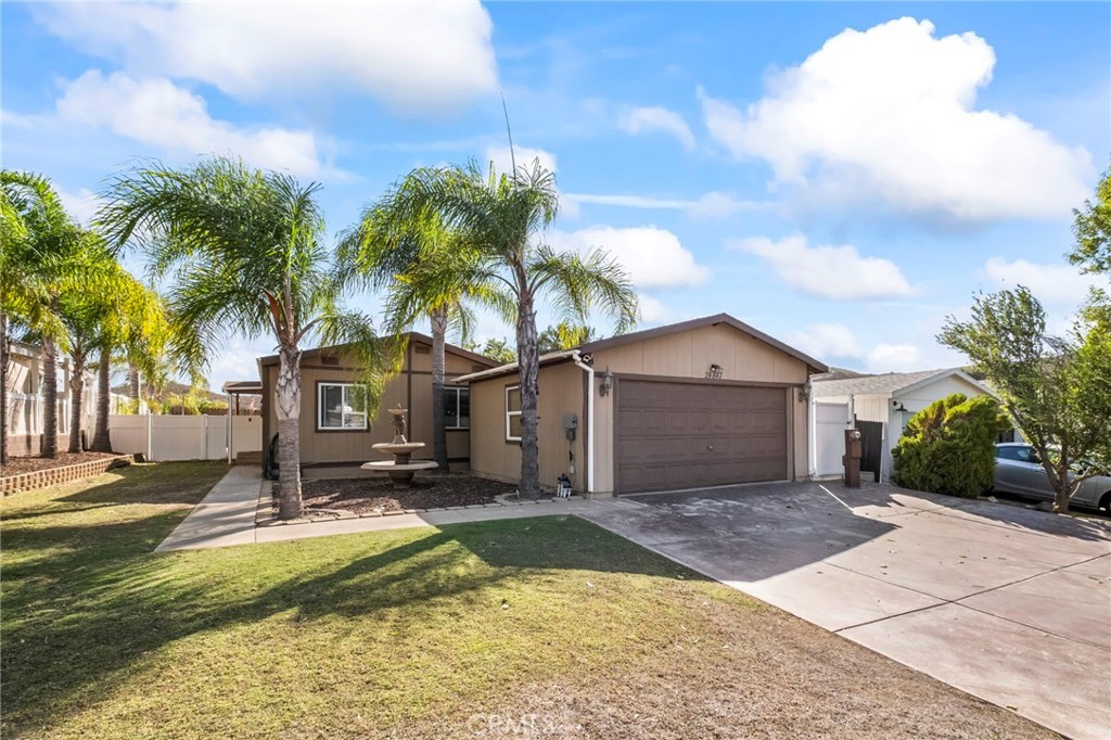 24847 Split Rail Road Wildomar, CA 92595 - Photo 40 of 45 a view of a house with a swimming pool and a large tree