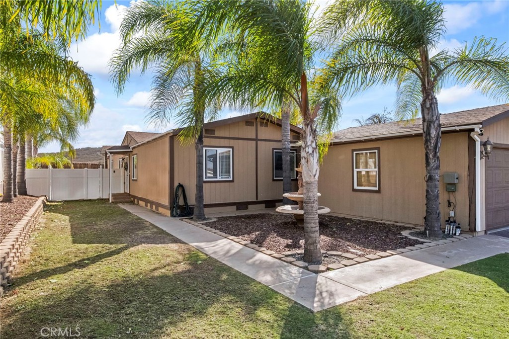 24847 Split Rail Road Wildomar, CA 92595 - Photo 44 of 45 a front view of a house with garden