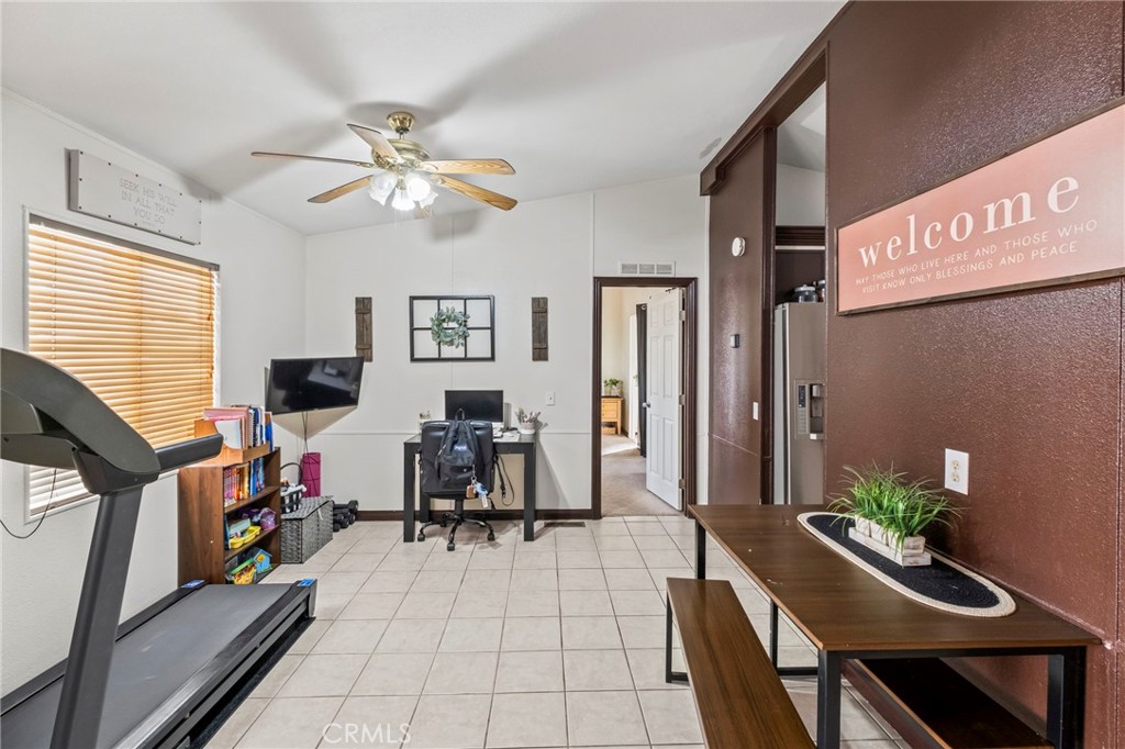 24847 Split Rail Road Wildomar, CA 92595 - Photo 6 of 45 a living room with furniture and a flat screen tv