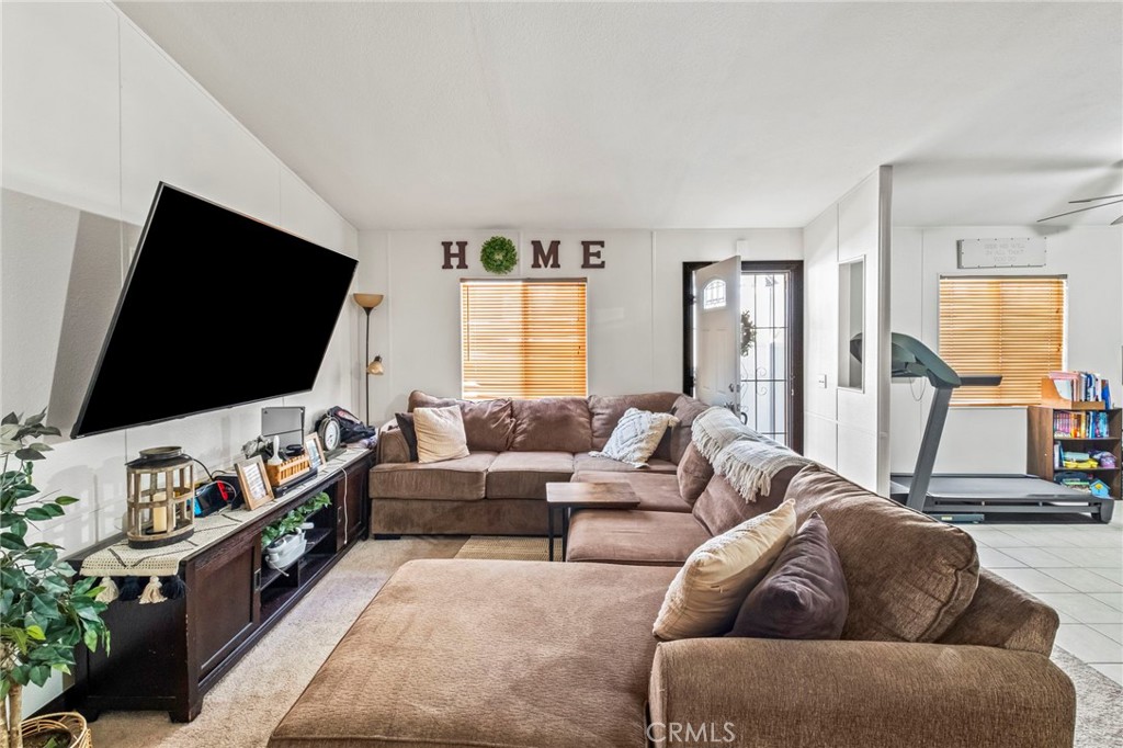 24847 Split Rail Road Wildomar, CA 92595 - Photo 8 of 45 a living room with furniture and a flat screen tv