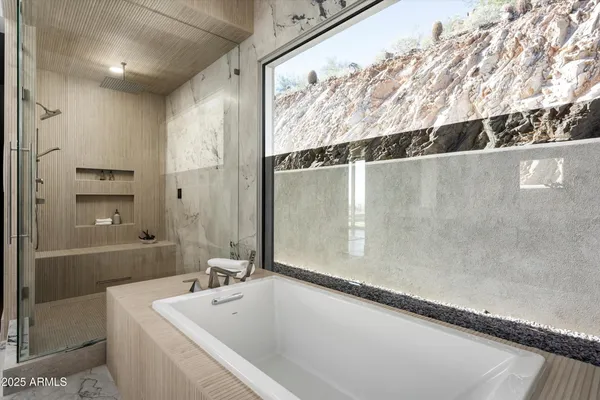 an empty room with sliding door and mountain view