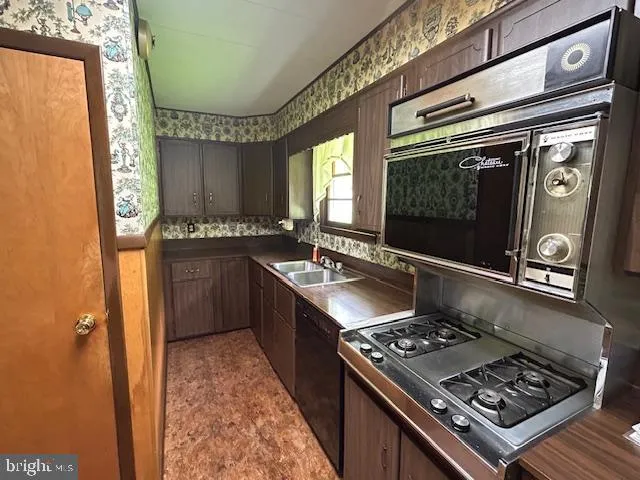 a dining room with a wooden table and chairs