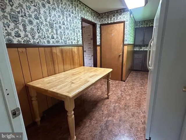 a kitchen with a refrigerator and a stove