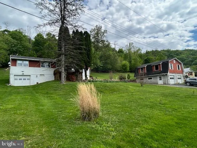 a view of a house with a big yard