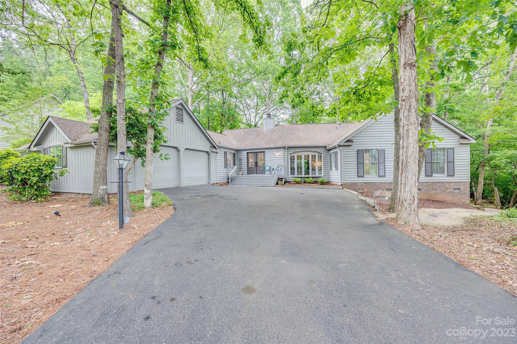 6 Sandy Cove Road Lake Wylie, SC 29710 - Photo 1 of 33 front view of a house with a street