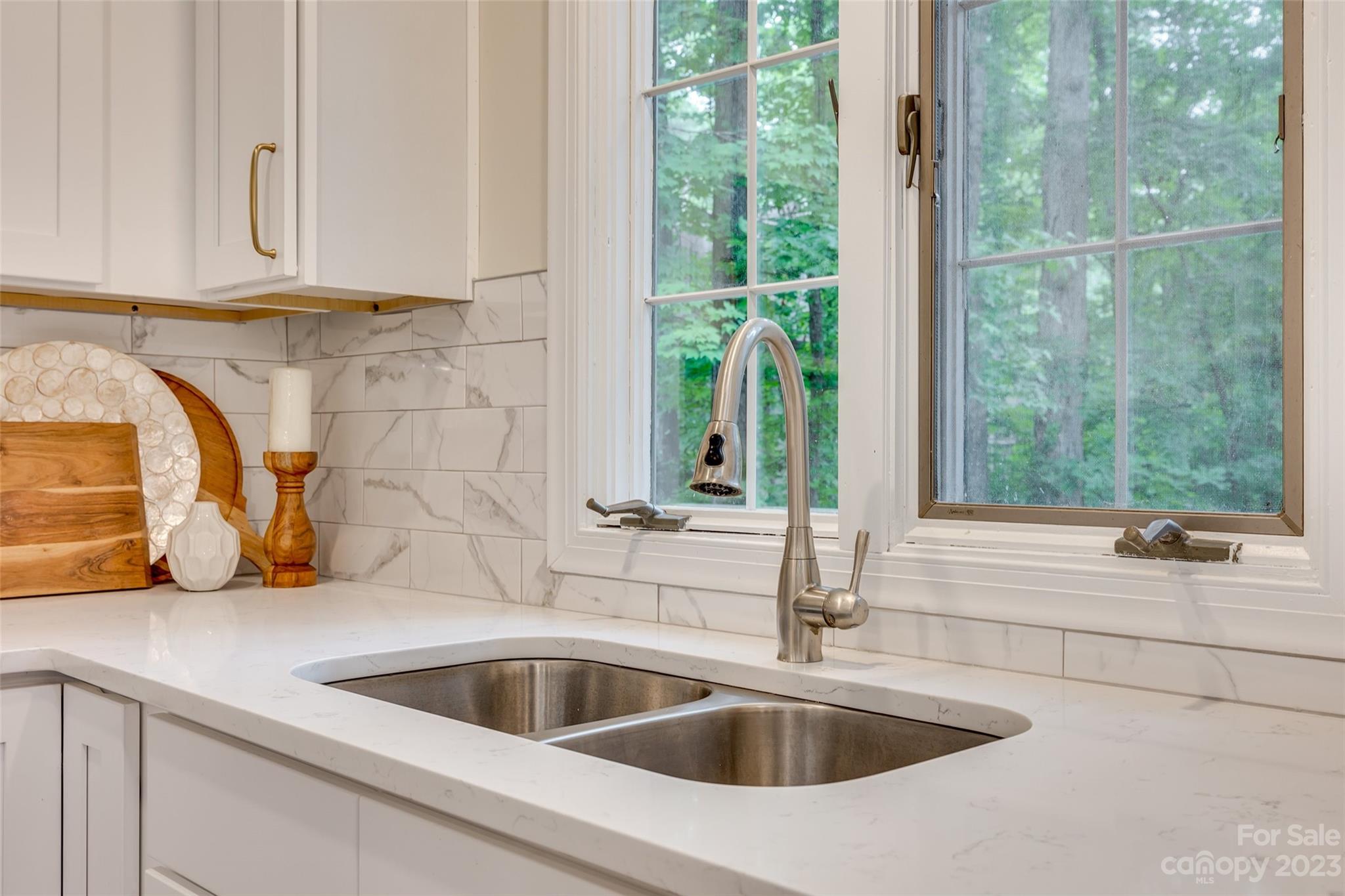 6 Sandy Cove Road Lake Wylie, SC 29710 - Photo 12 of 33 a kitchen with a sink and cabinet