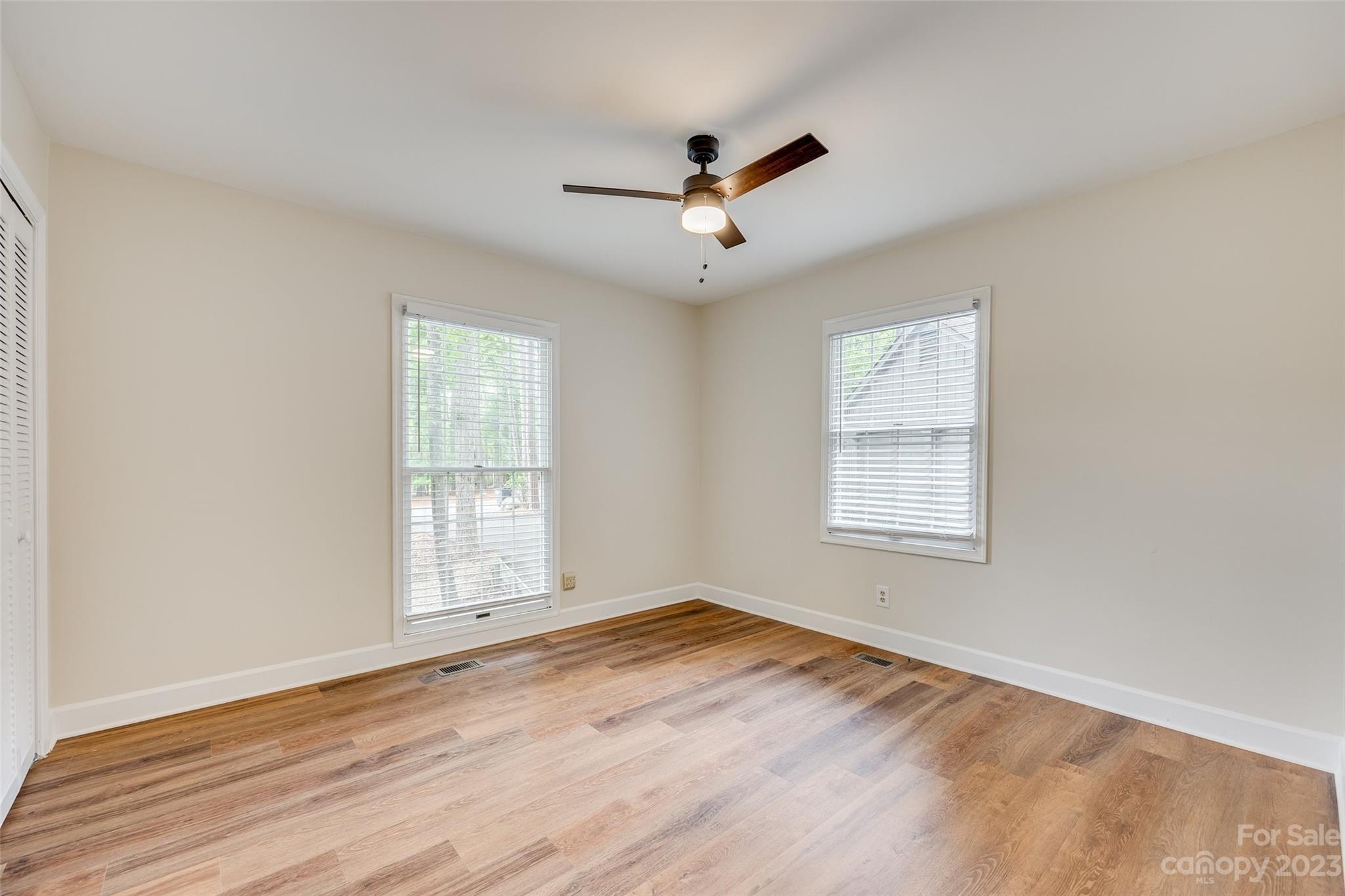 6 Sandy Cove Road Lake Wylie, SC 29710 - Photo 17 of 33 a view of empty room with wooden floor and fan