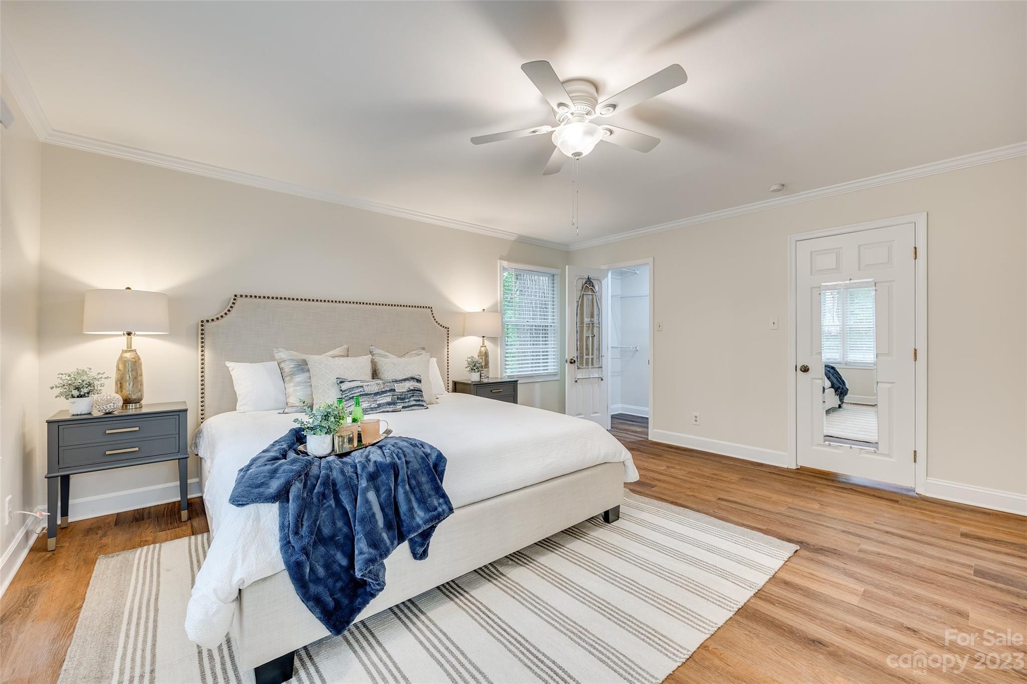 6 Sandy Cove Road Lake Wylie, SC 29710 - Photo 21 of 33 a spacious bedroom with a bed and wooden floor