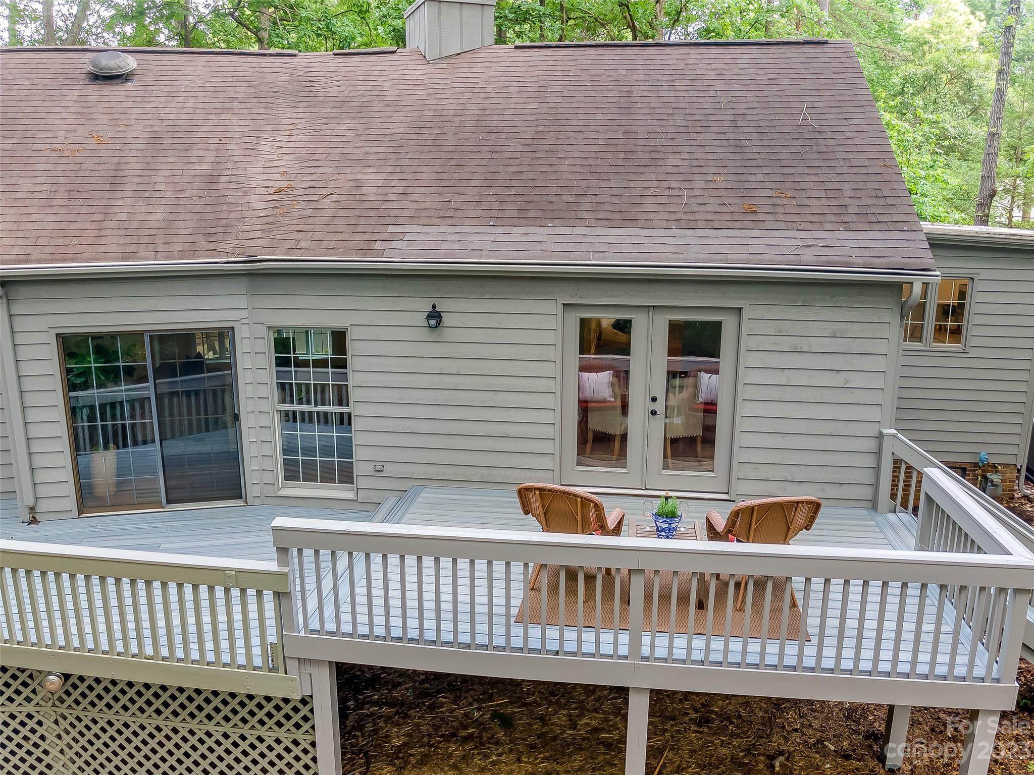 6 Sandy Cove Road Lake Wylie, SC 29710 - Photo 29 of 33 a view of a house with a deck and furniture