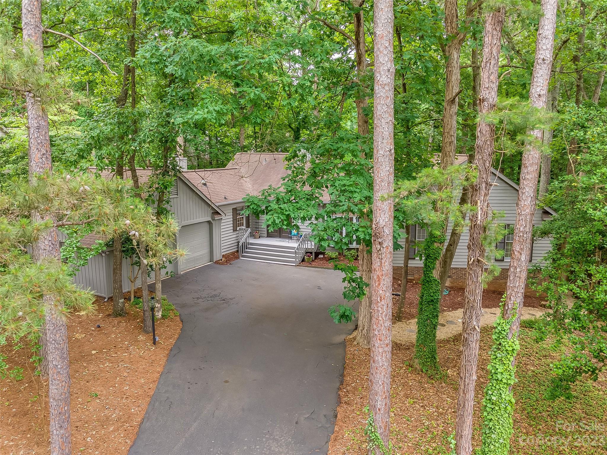 6 Sandy Cove Road Lake Wylie, SC 29710 - Photo 31 of 33 a view of a patio with table and chairs and potted plants
