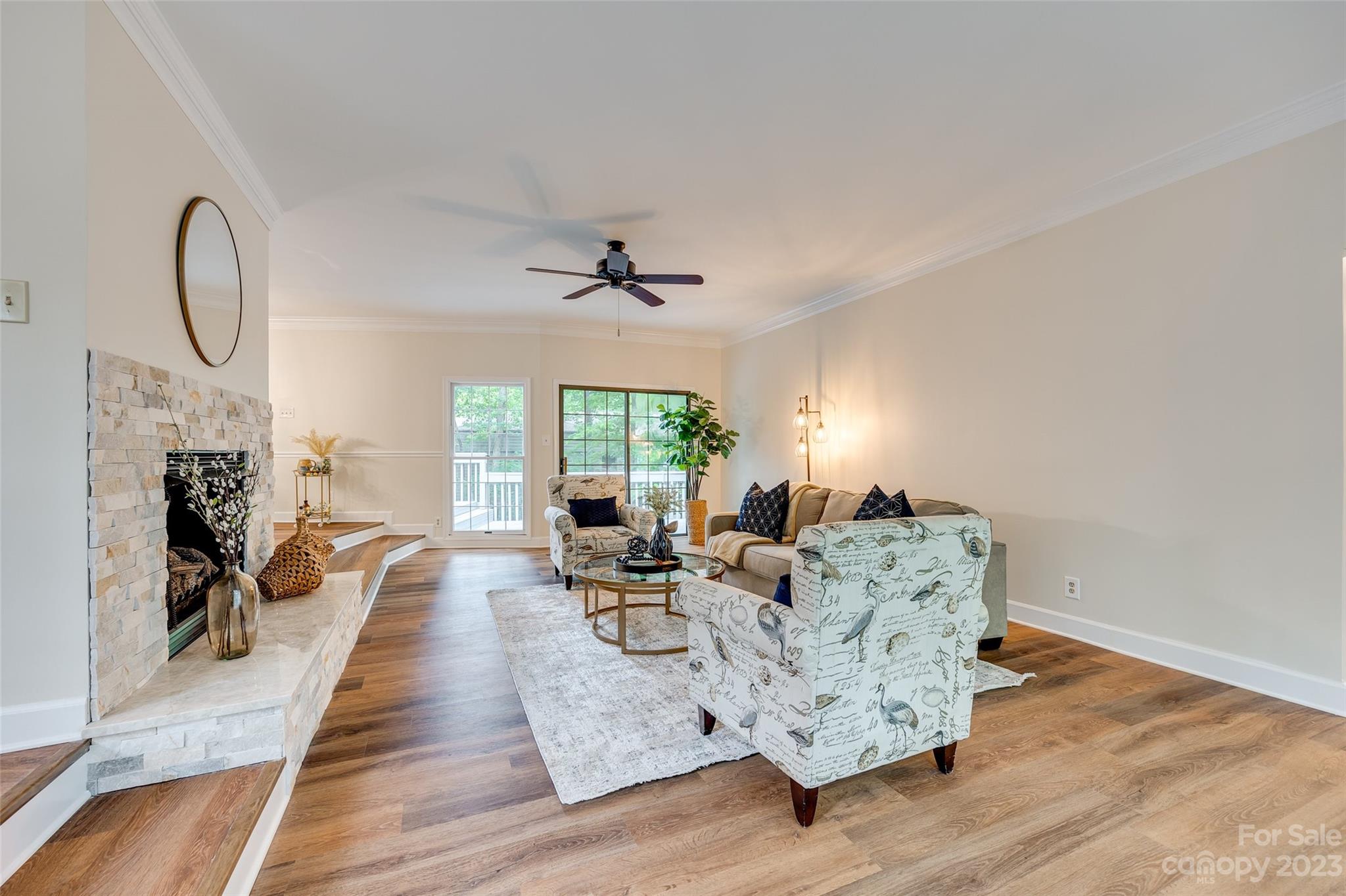 6 Sandy Cove Road Lake Wylie, SC 29710 - Photo 4 of 33 a living room with furniture and a fireplace