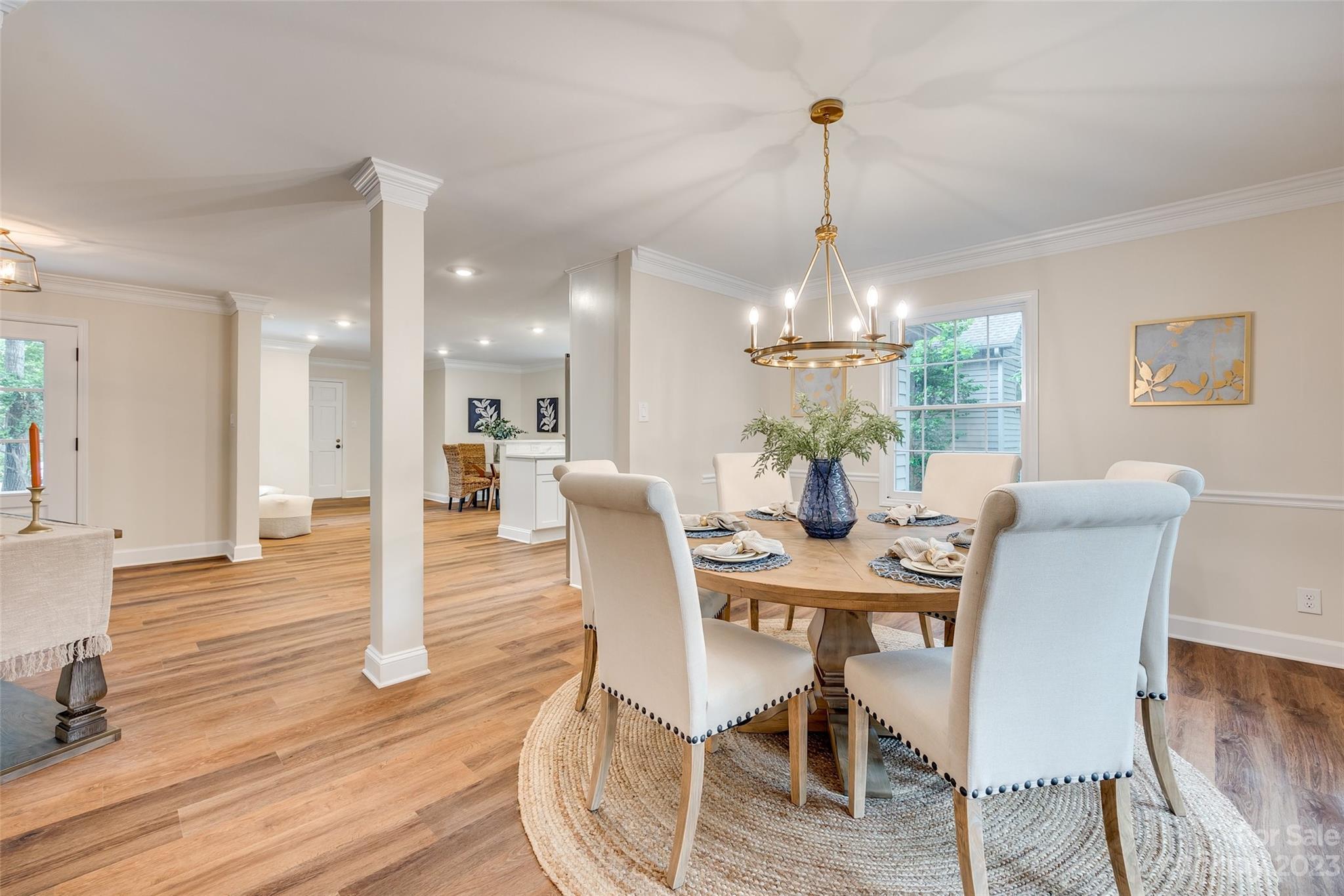 6 Sandy Cove Road Lake Wylie, SC 29710 - Photo 8 of 33 a view of a dining room with furniture wooden floor and chandelier