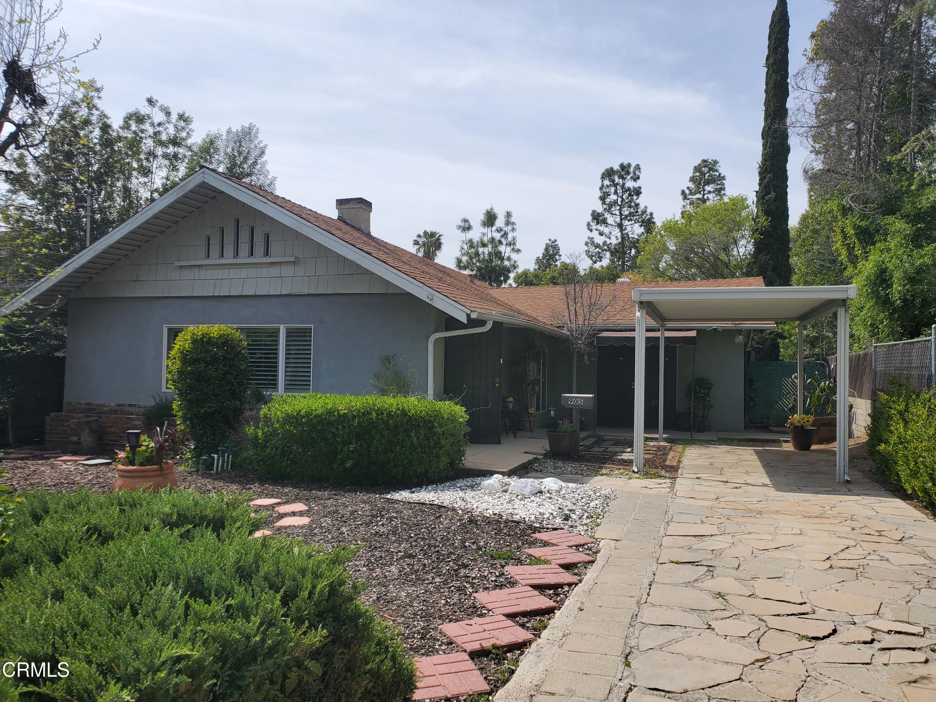 905 Chapman Avenue Pasadena, CA 91103 - Photo 2 of 20 a front view of a house with a yard and potted plants