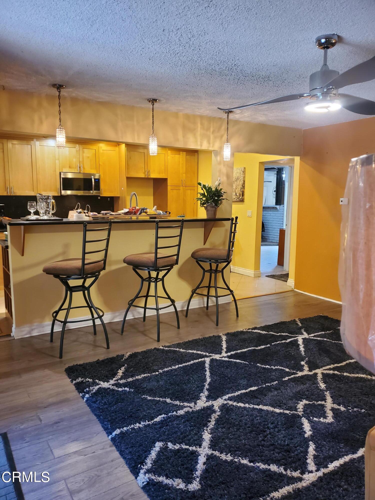 905 Chapman Avenue Pasadena, CA 91103 - Photo 7 of 20 a room with table chairs and wooden floor