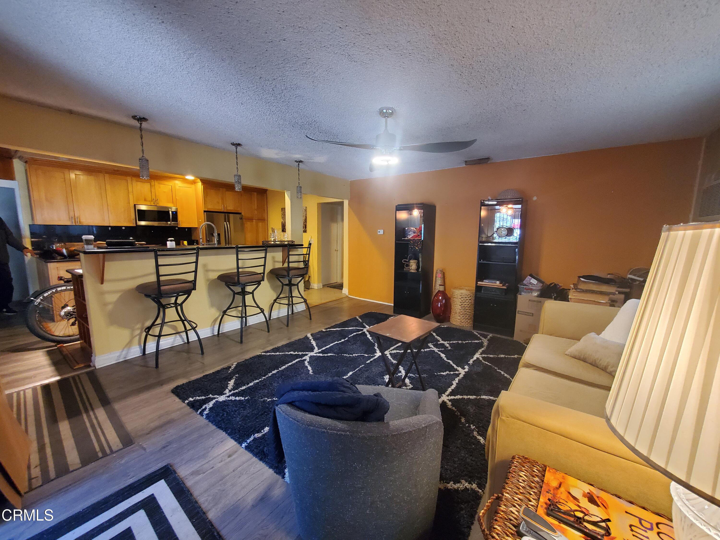 905 Chapman Avenue Pasadena, CA 91103 - Photo 9 of 20 a room with lots of chairs and mirrors