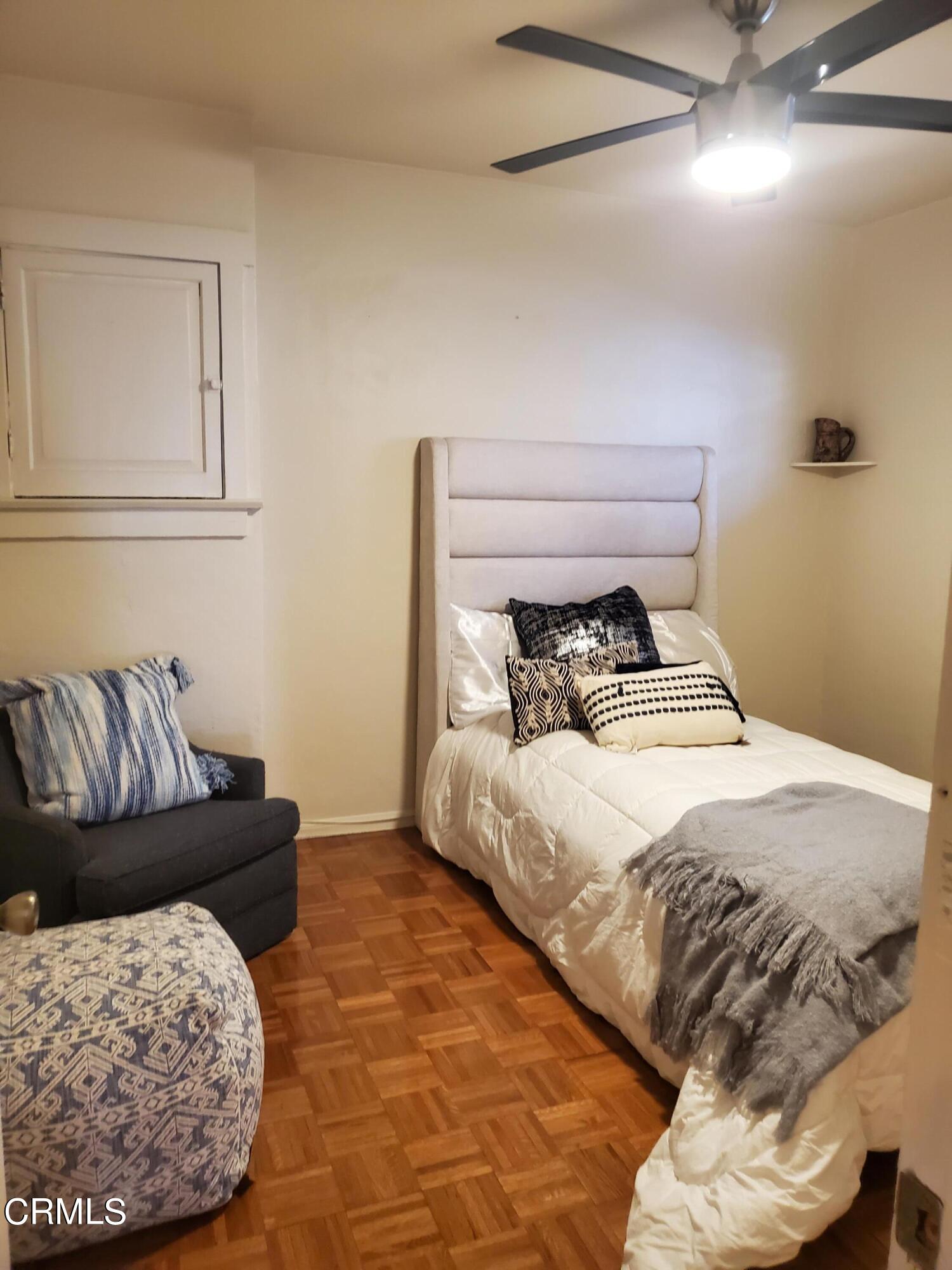 905 Chapman Avenue Pasadena, CA 91103 - Photo 10 of 20 a bedroom with a bed and a couch