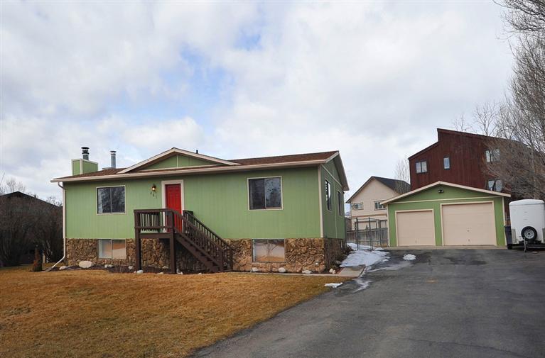 exterior front & large detached garage