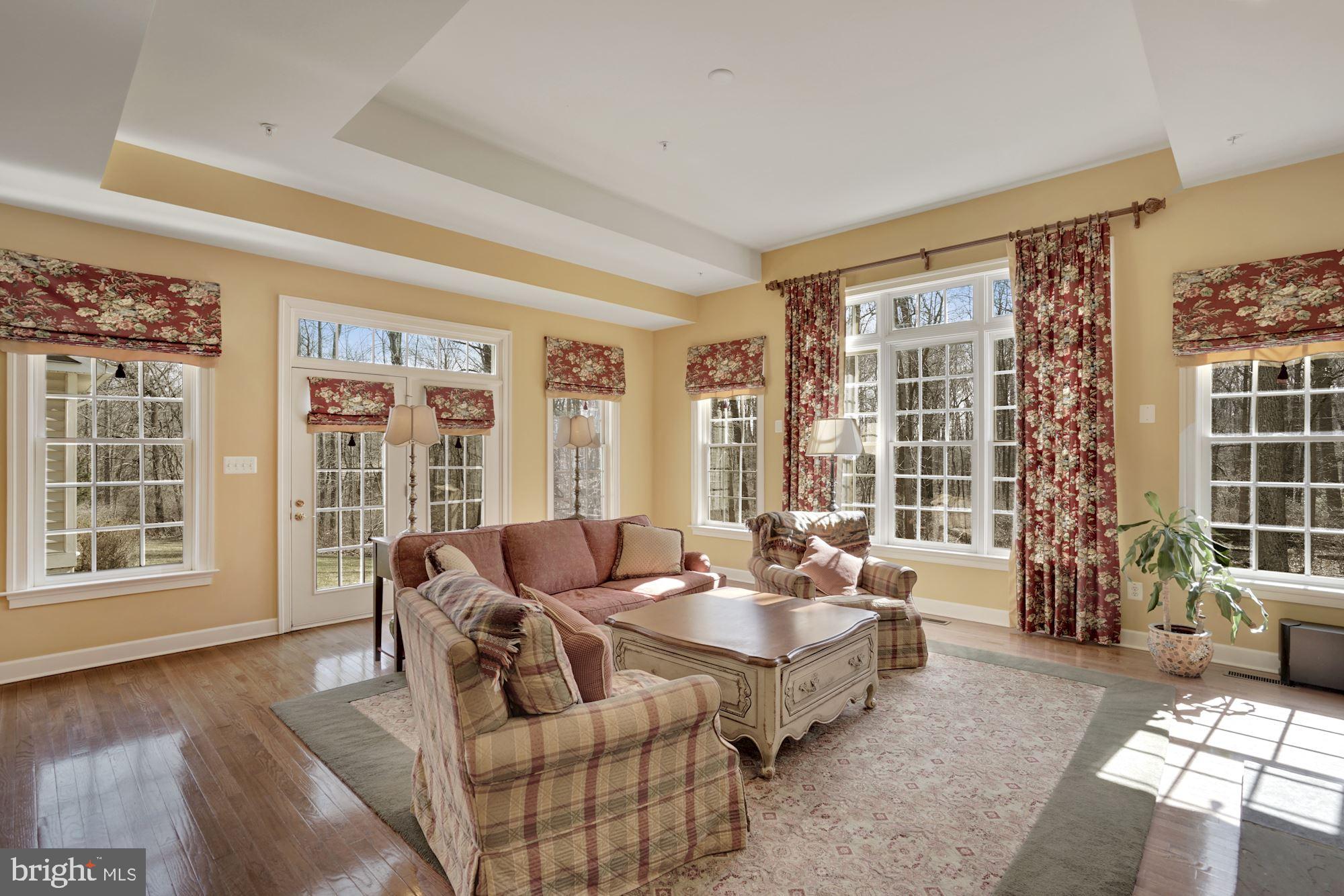 17501 Nesbitt Farm Lane Sandy Spring, MD 20860 - Photo 18 of 61 family room is surrounded by windows