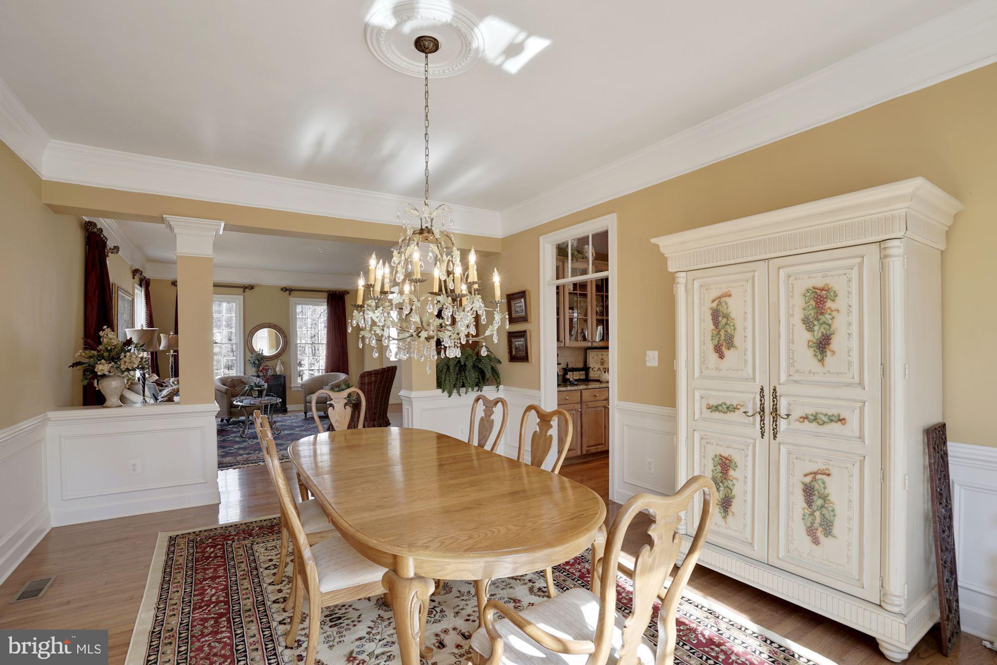 17501 Nesbitt Farm Lane Sandy Spring, MD 20860 - Photo 4 of 61 formal dining room with a beautiful chandelier